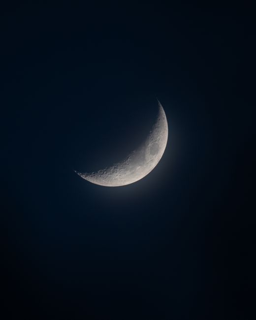 A stunning crescent moon against a dark night sky, perfect for nature lovers and astronomy enthusiasts.