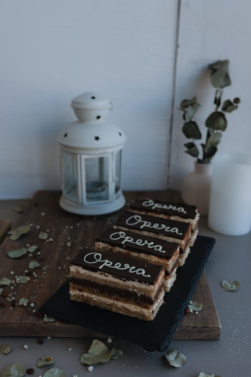 A cake with a candle on top and a sign that says, 'dessert'
