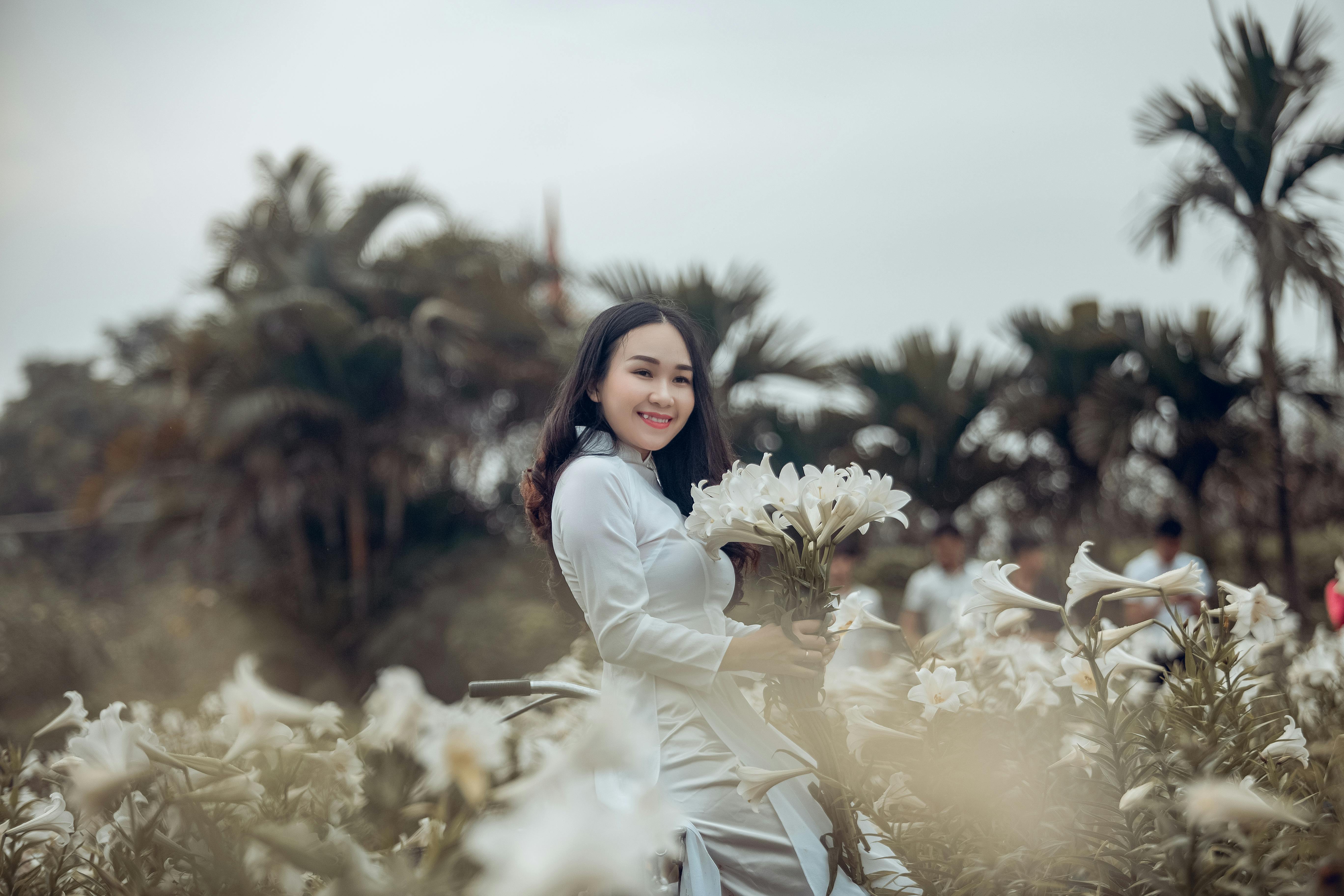 pretty little girl in burgundy dress with white umbrella on sunny day.  concept of fashion Stock Photo - Alamy