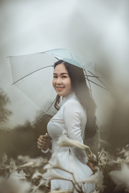 Smiling Woman Wearing White Long-sleeved Dress Holding White Umbrella