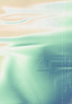 Abstract pastel gradient art with soft waves and vintage texture.