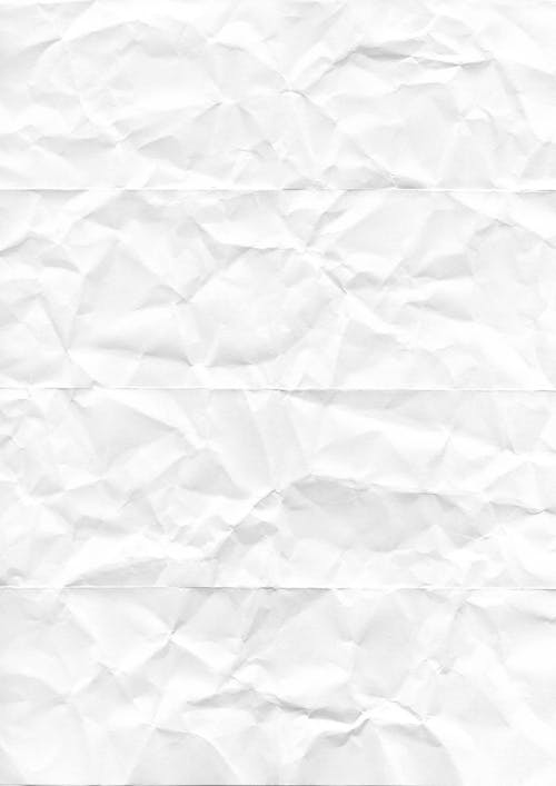 A white crumpled paper on a gray background