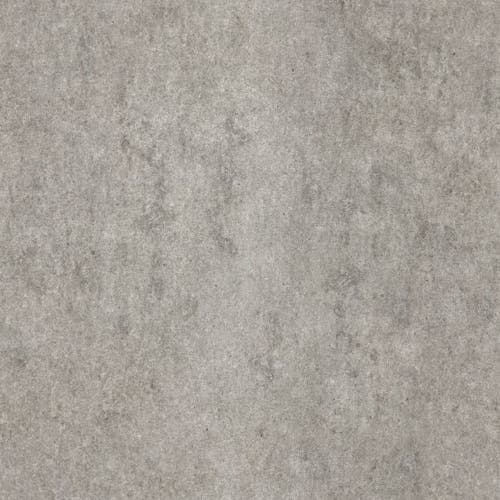 A gray concrete floor with some dirt on it