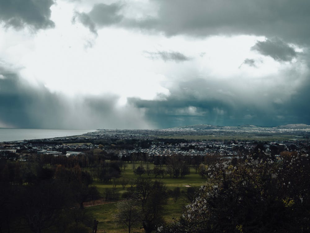 A view of a city and a cloudy sky