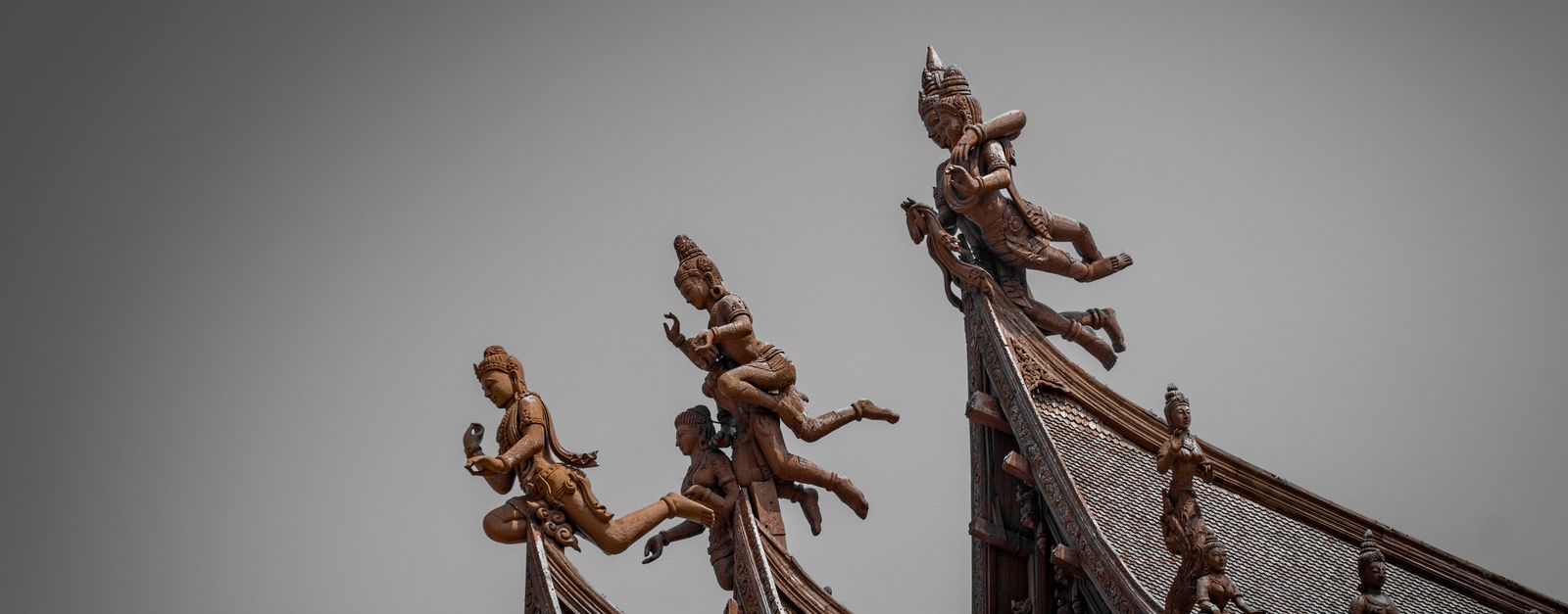 Detailed view of wooden sculptures on the roof of Sanctuary of Truth, Pattaya, Thailand