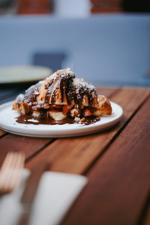 A piece of chocolate covered waffle on a plate