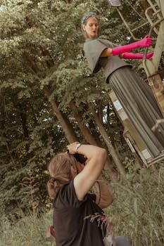 Elegant outdoor fashion shoot capturing vibrant attire amid lush greenery.