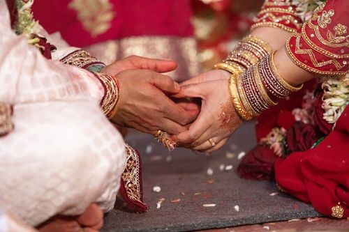 Free Close-up of hands during a Nepali wedding ceremony in Kathmandu, featuring intricate henna designs and jewelry. Stock Photo