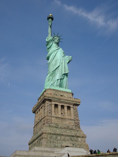 Free Iconic view of the Statue of Liberty against a clear sky in New York City. Stock Photo