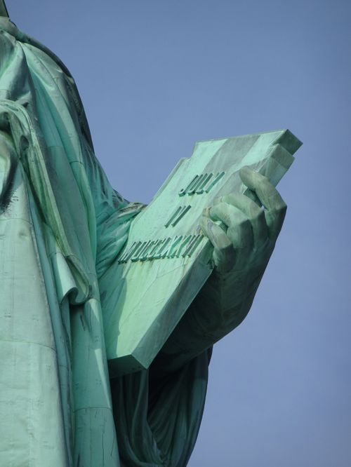 Free Detailed view of the Statue of Liberty's tablet, showcasing July IV, MDCCLXXVI inscription. Stock Photo