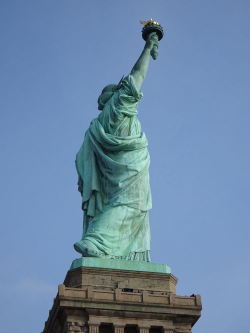 Free Low-angle view of the Statue of Liberty, an iconic symbol of freedom in New York City. Stock Photo