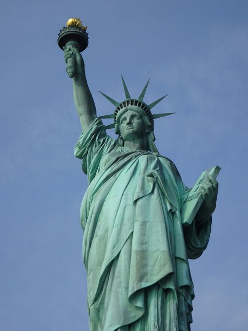 Free Close-up of the iconic Statue of Liberty in New York City with a clear blue sky backdrop. Stock Photo