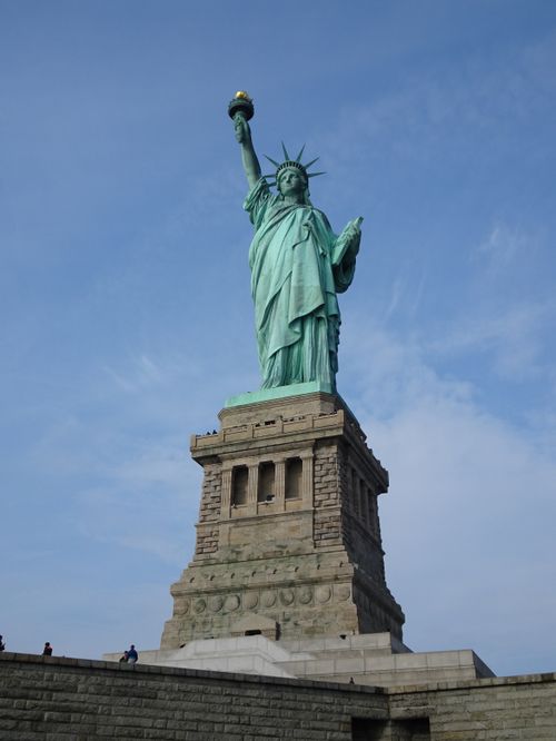 Free Majestic view of the Statue of Liberty in New York, a symbol of freedom and democracy. Stock Photo