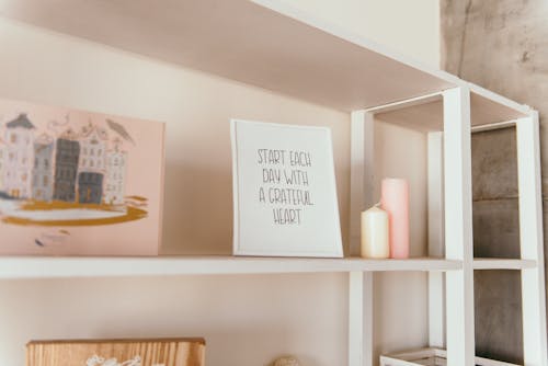 Quote Sign Standing on Wooden Shelf