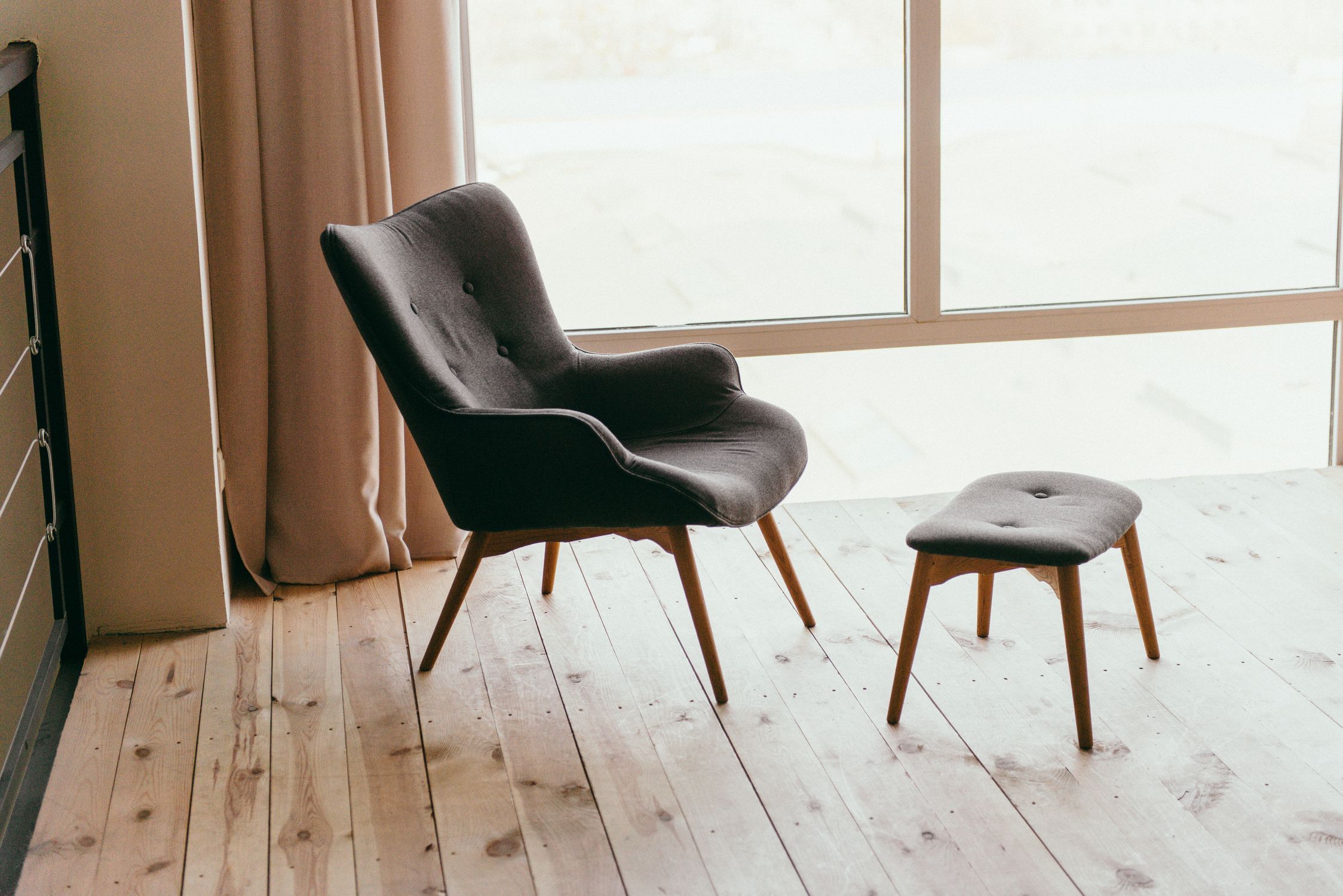 Made To Order Sofas Uk — Why They Last Longer And Cost Less Over Time Made To Order Sofas Uk — Craftsman Assembling Hardwood Sofa Frame In European Furniture Workshop