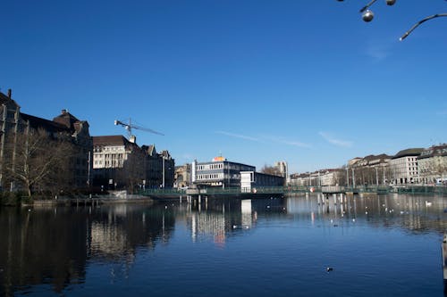 Landscape Photography of High Rise Building Near Body of Water