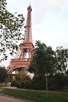 Captivating view of the Eiffel Tower surrounded by lush greenery in Paris.