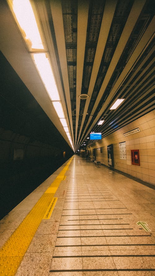A subway station with a long walkway