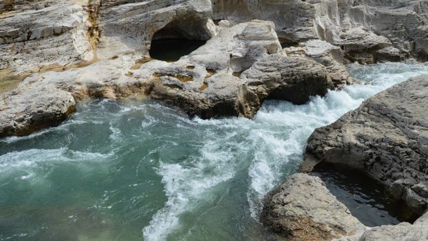 Rocks around River and Waterfall
