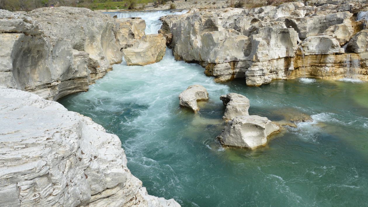 Green Water Off Rocks A river with white rocks and green water · Free Stock Photo