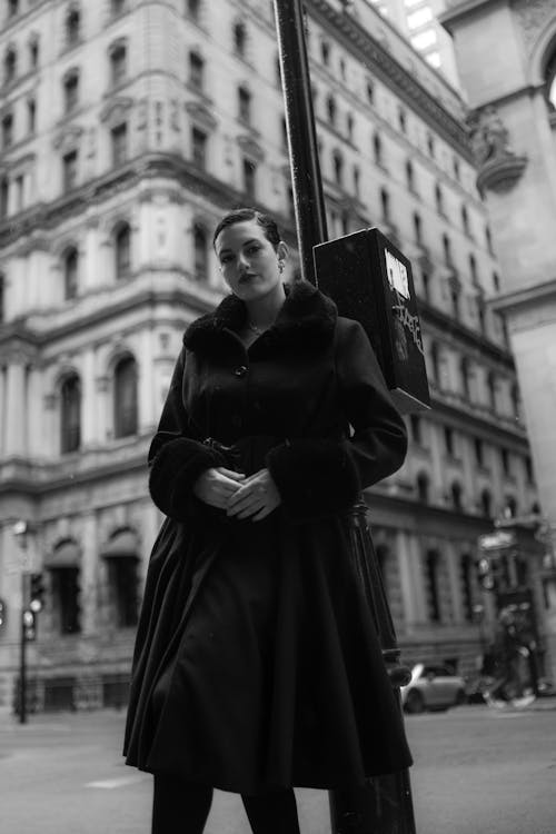 Black and white photo of woman in fur coat