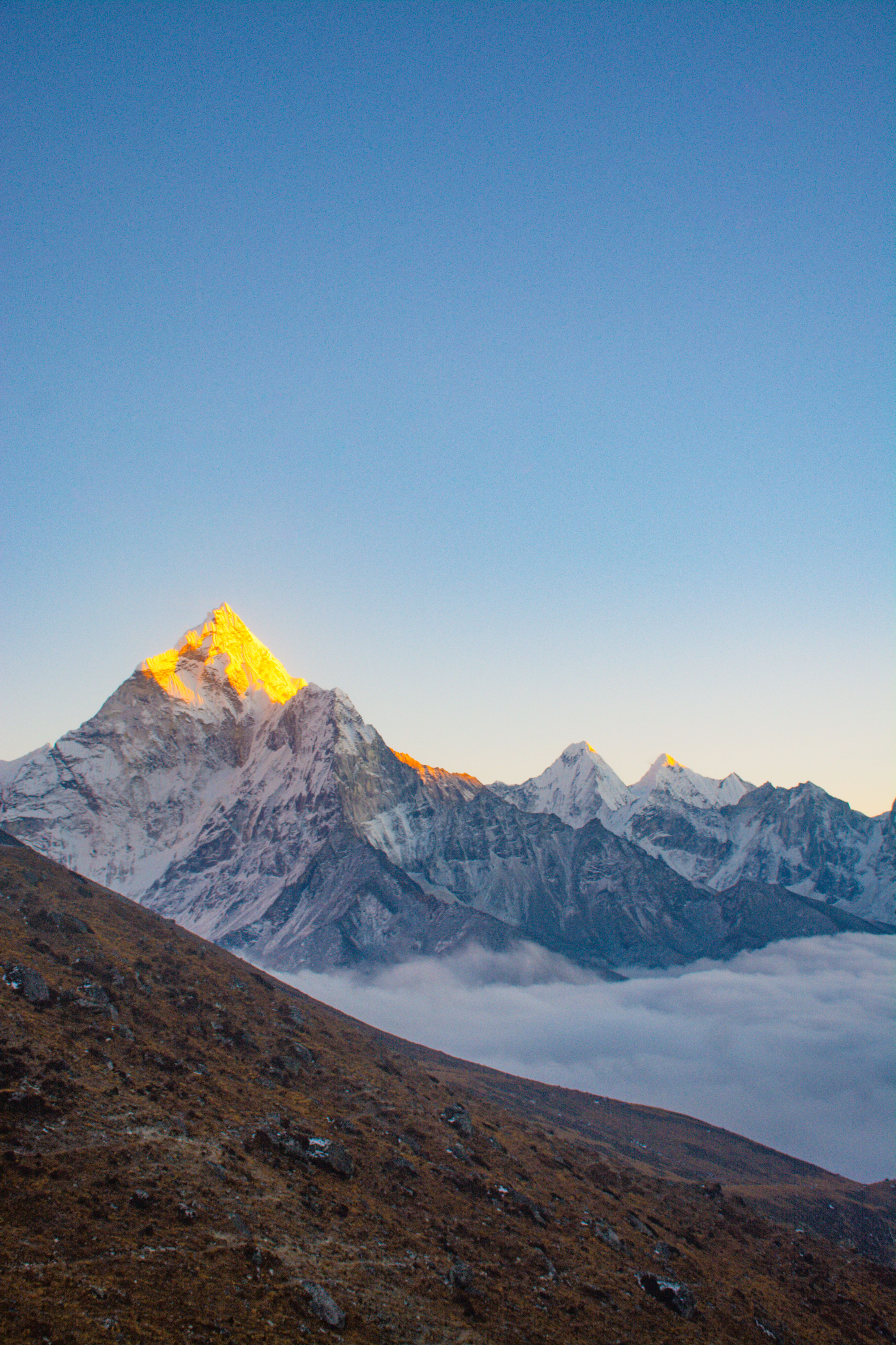 Majestic sunrise over snow-capped Himalayan peaks in Dingboche, Nepal.