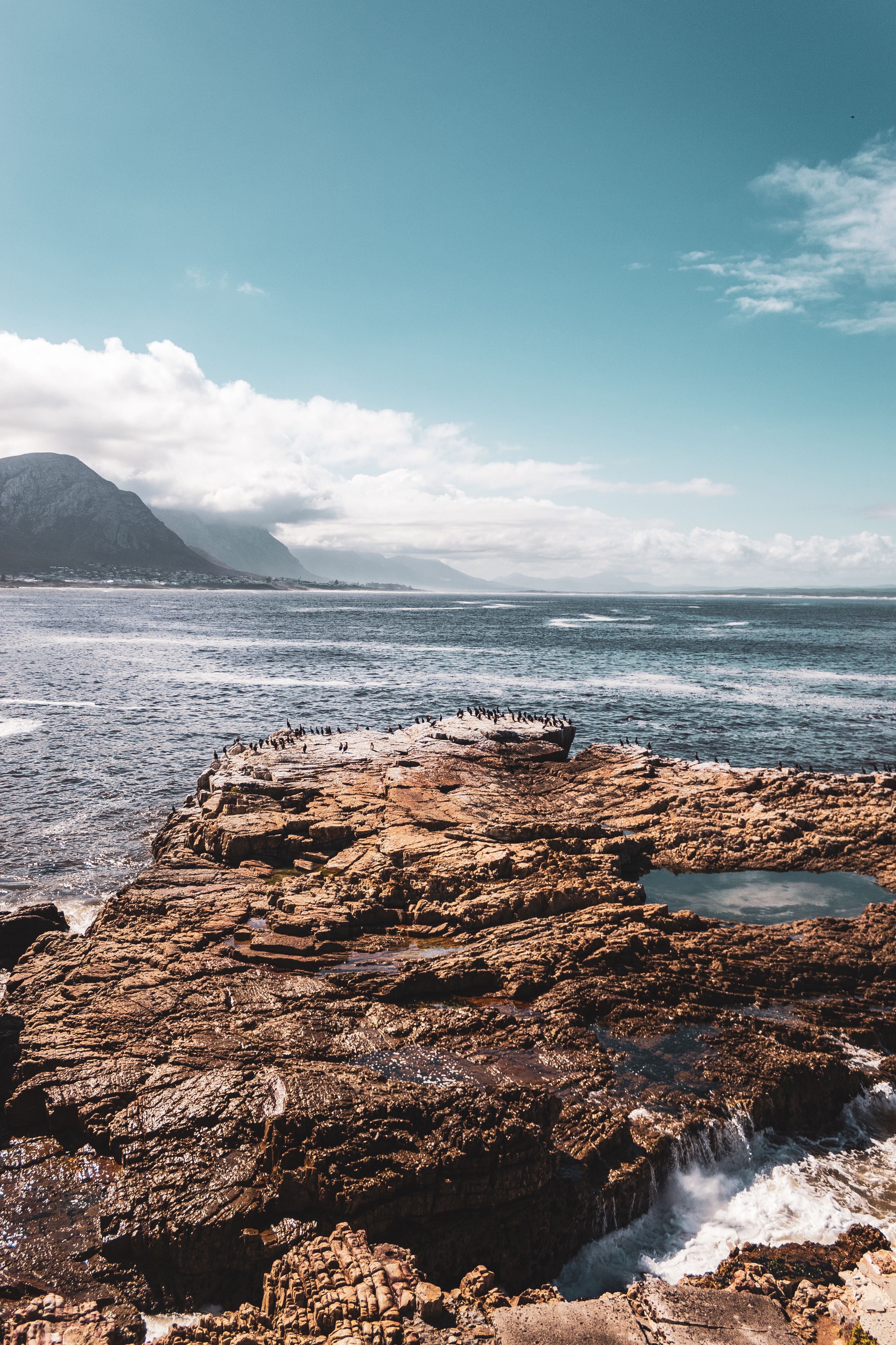 Bird's-eye View Photography of Rock Formation on Ocean · Free Stock Photo