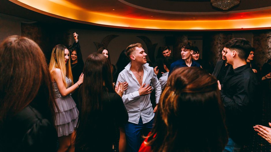 people enjoying karaoke singing together