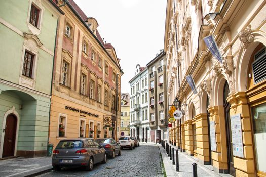 Cobbled street in Prague's Old Town, featuring historic architecture and vibrant facades.