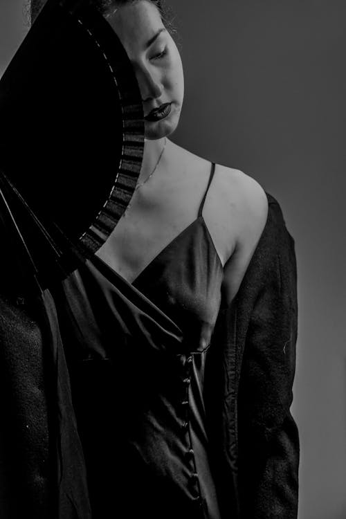 Portrait of a Female Model Holding a Folding Fan