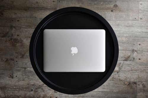 A laptop sitting on top of a black tray