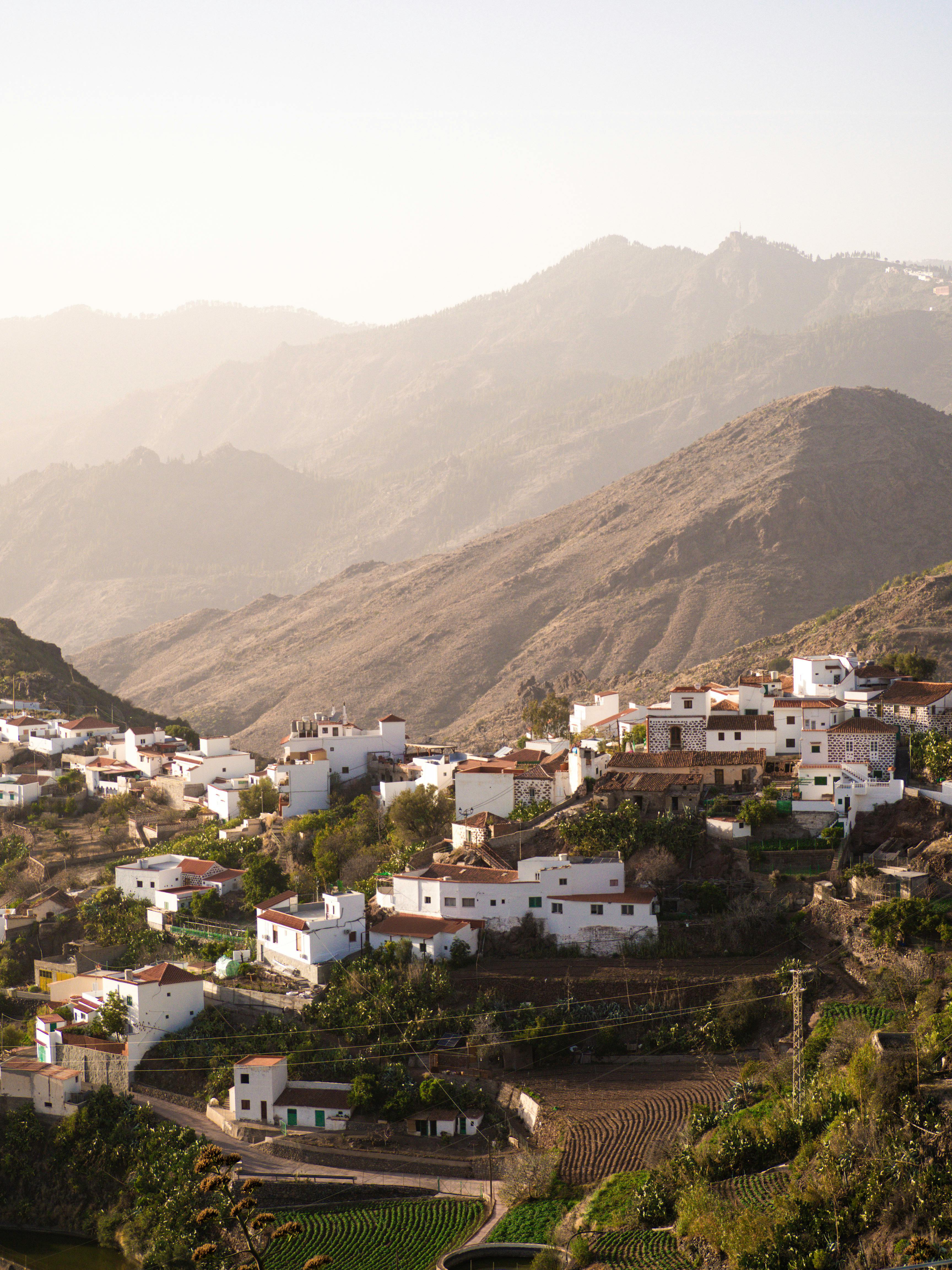 Aerial view of Tejeda village with mountainous backdrop in Gran Canaria, Spain.