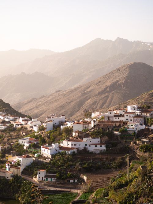 Free Aerial view of Tejeda village with mountainous backdrop in Gran Canaria, Spain. Stock Photo
