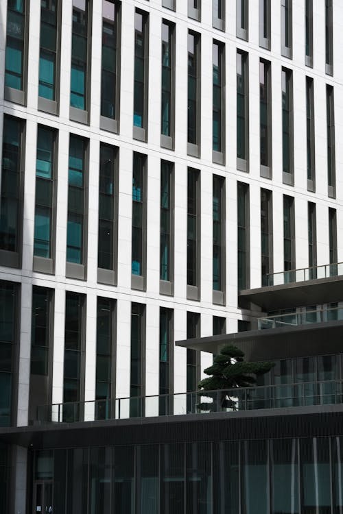 A tall building with windows and balconies