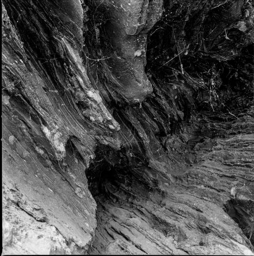 Free Close-up of a black and white textured rock surface showing natural rugged formations. Stock Photo