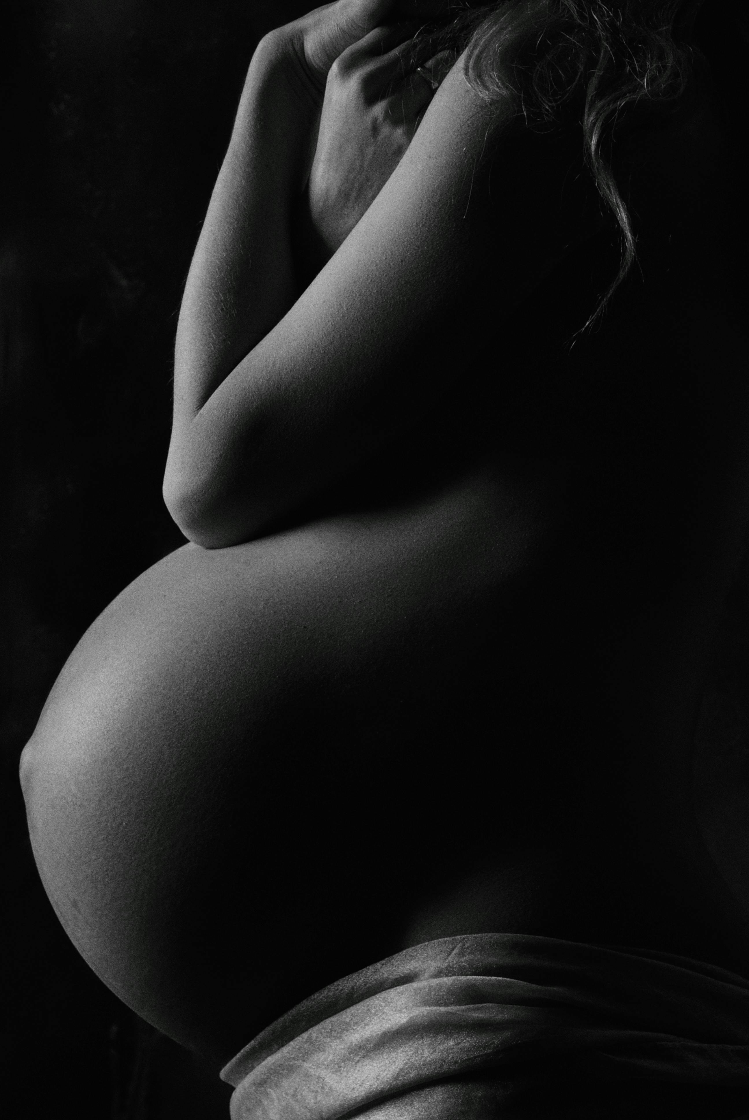 topless pregnant woman