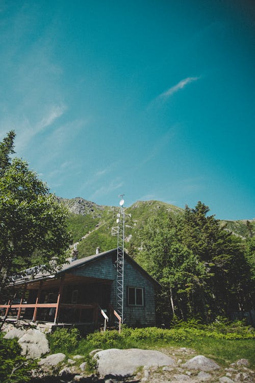 Free stock photo of blue skies, cabin, green