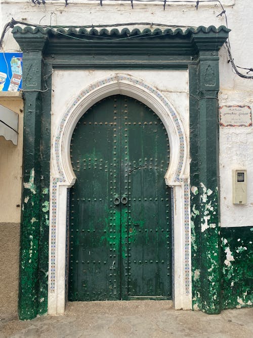 A green door with a green and white door