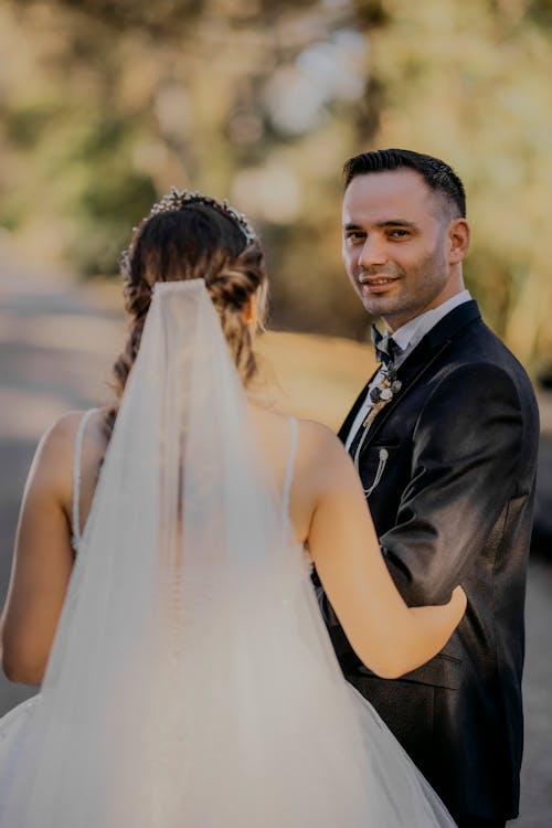 A bride and groom look at each other