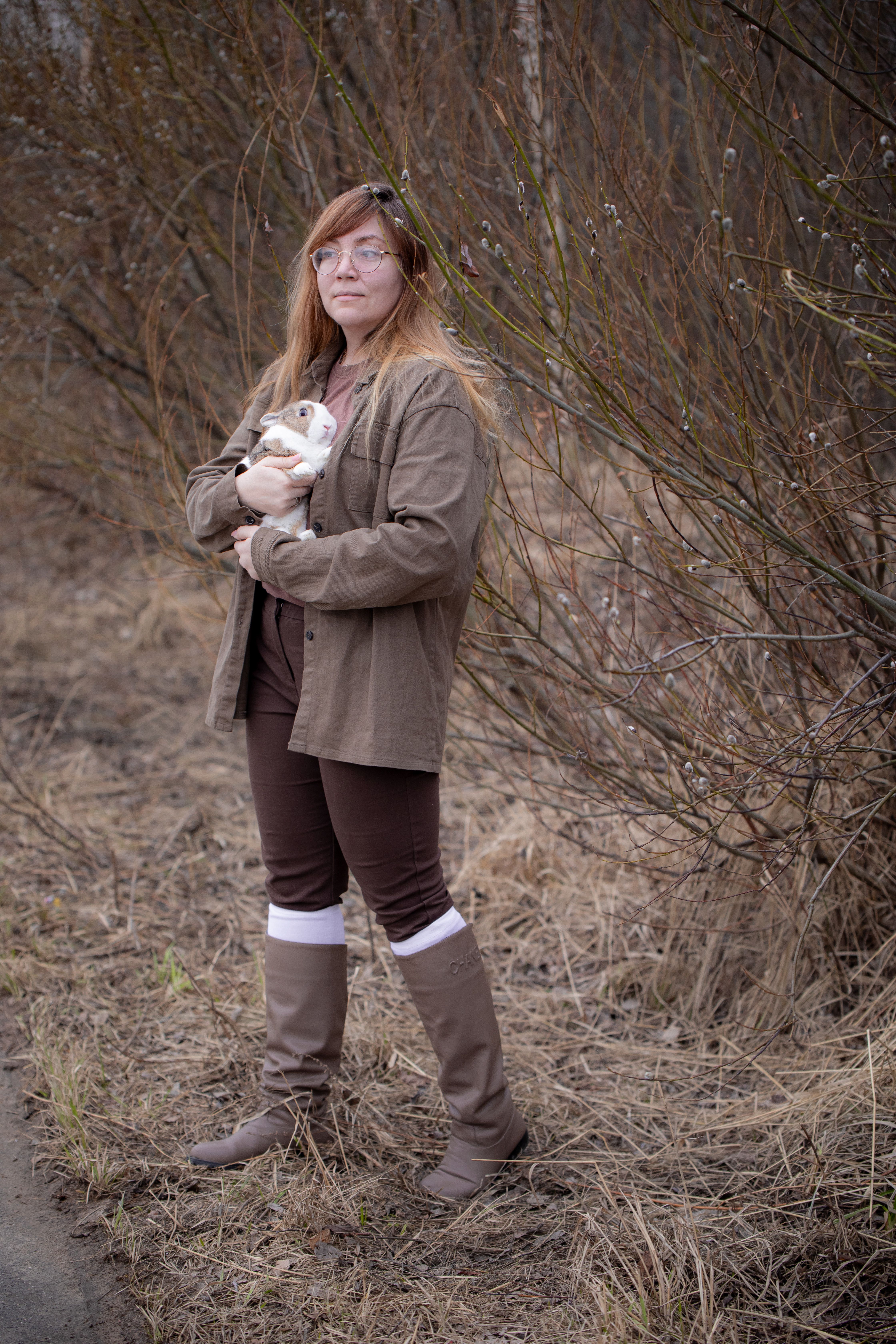 Woman with a Rabbit Standing on the Roadside · Free Stock Photo