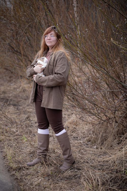 Woman with a Rabbit Standing on the Roadside · Free Stock Photo