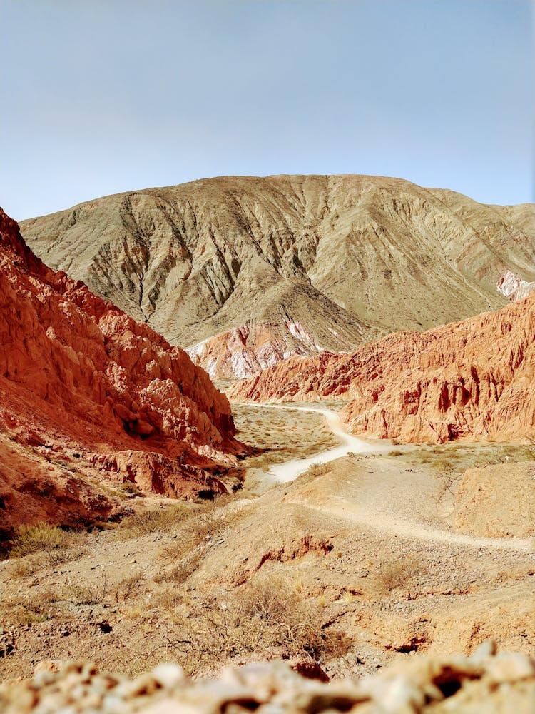 Trail On Wasteland Near Mountain