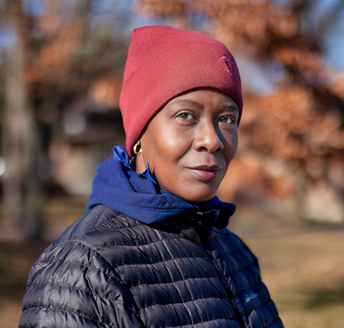 A woman in a red beanie and jacket