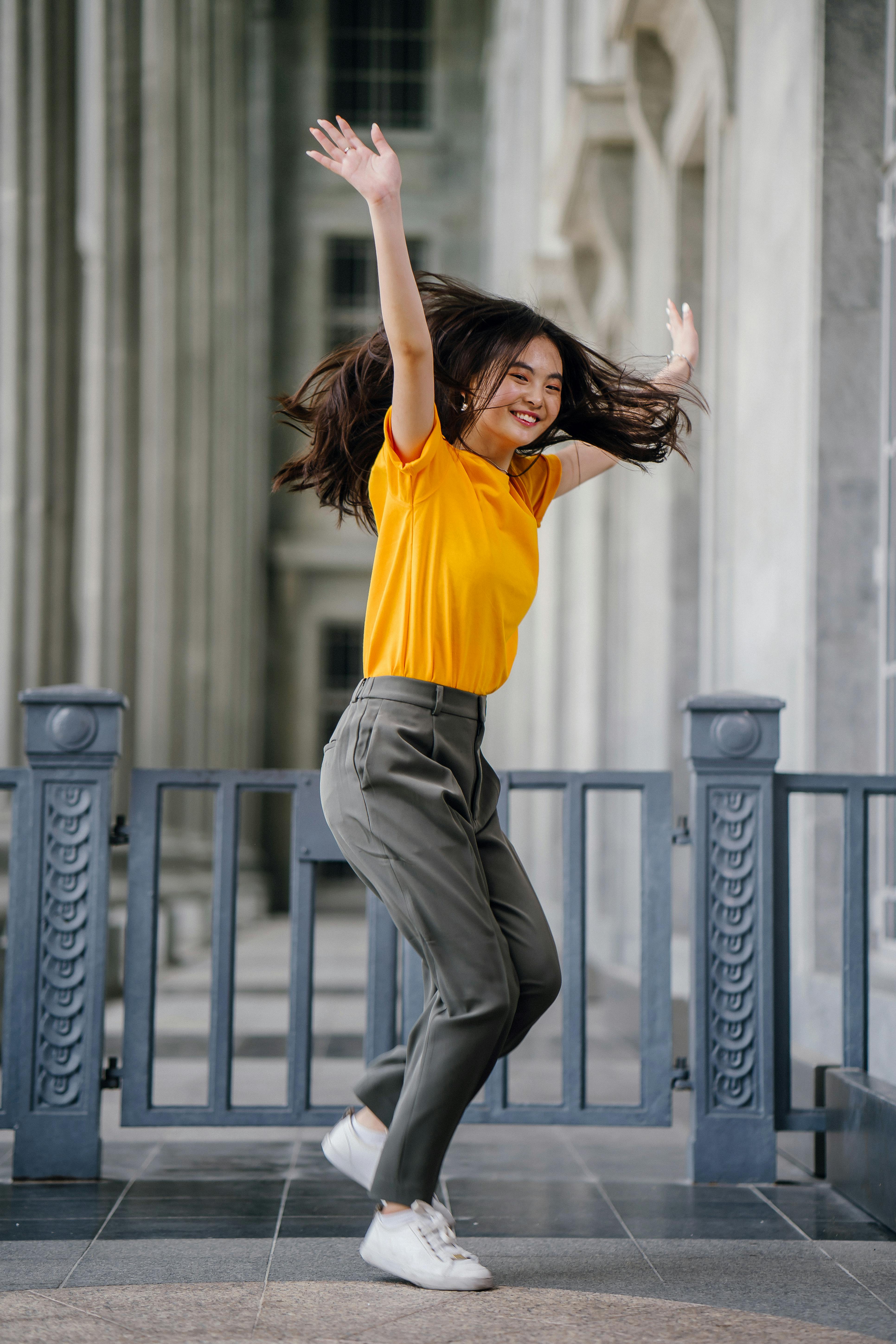 grey pants and yellow shirt