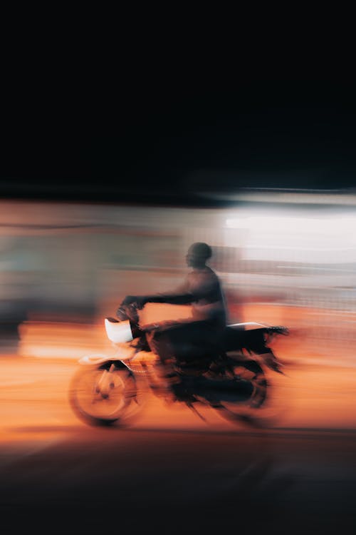 Man Riding a Bike at Dusk 