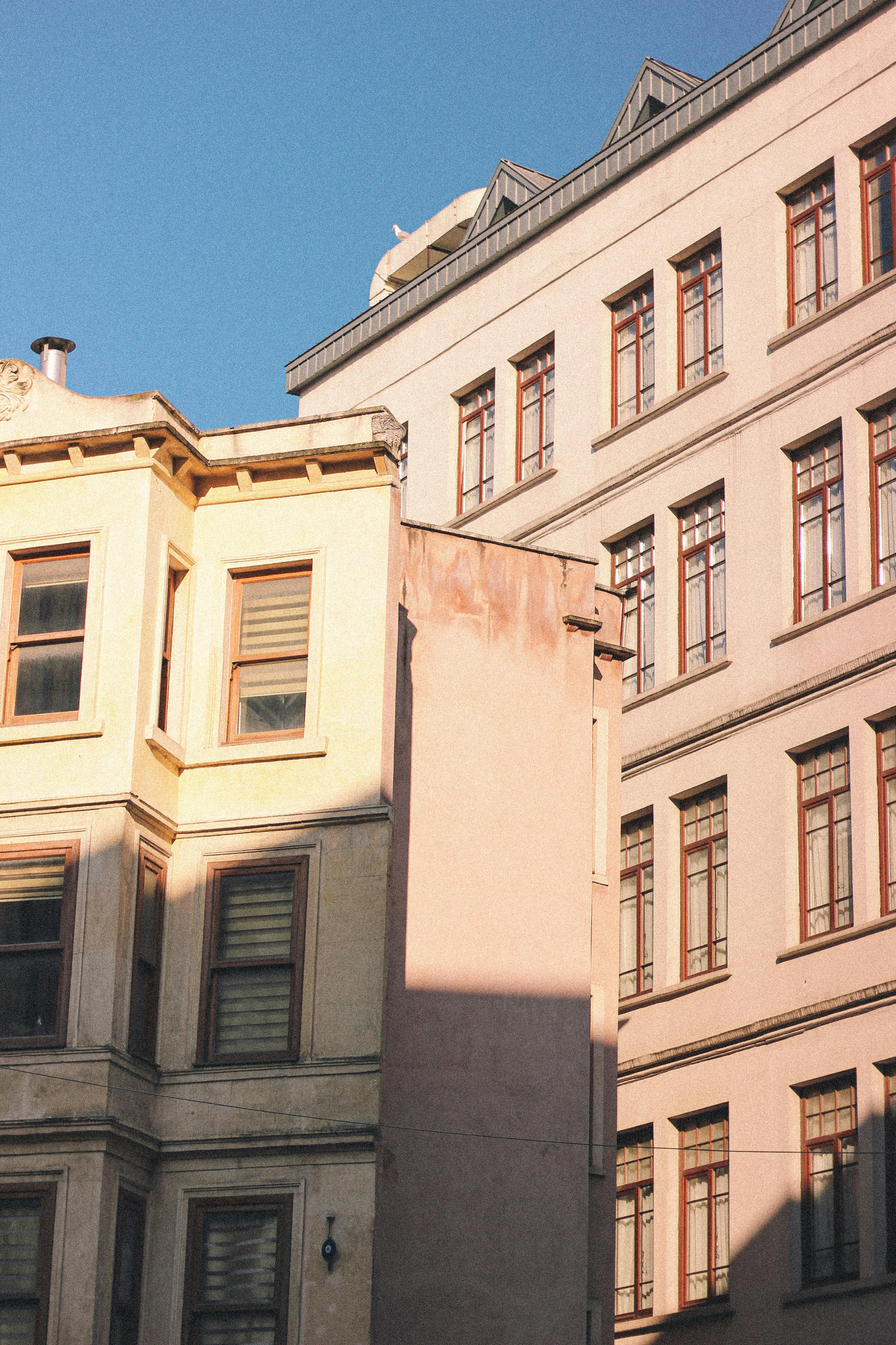 Sunlit residential buildings showcasing urban architecture with a warm ambiance.