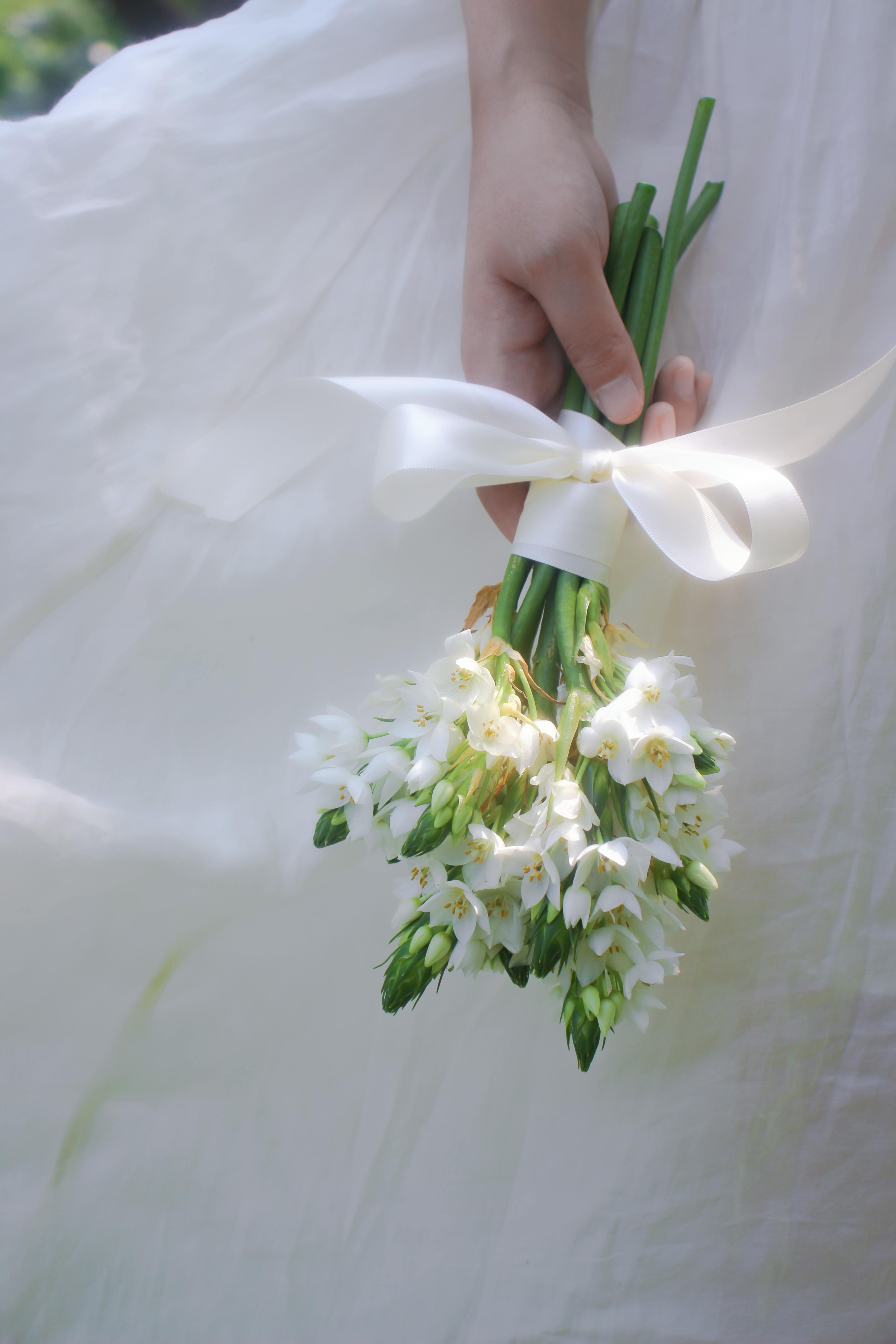 white flowers in bride hand