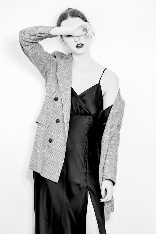 Woman Posing in Blazer and Dress in Black and White 