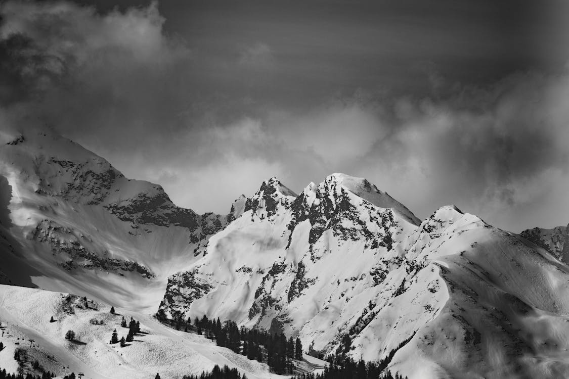 Grayscale Photo of Snow Capped Mountain