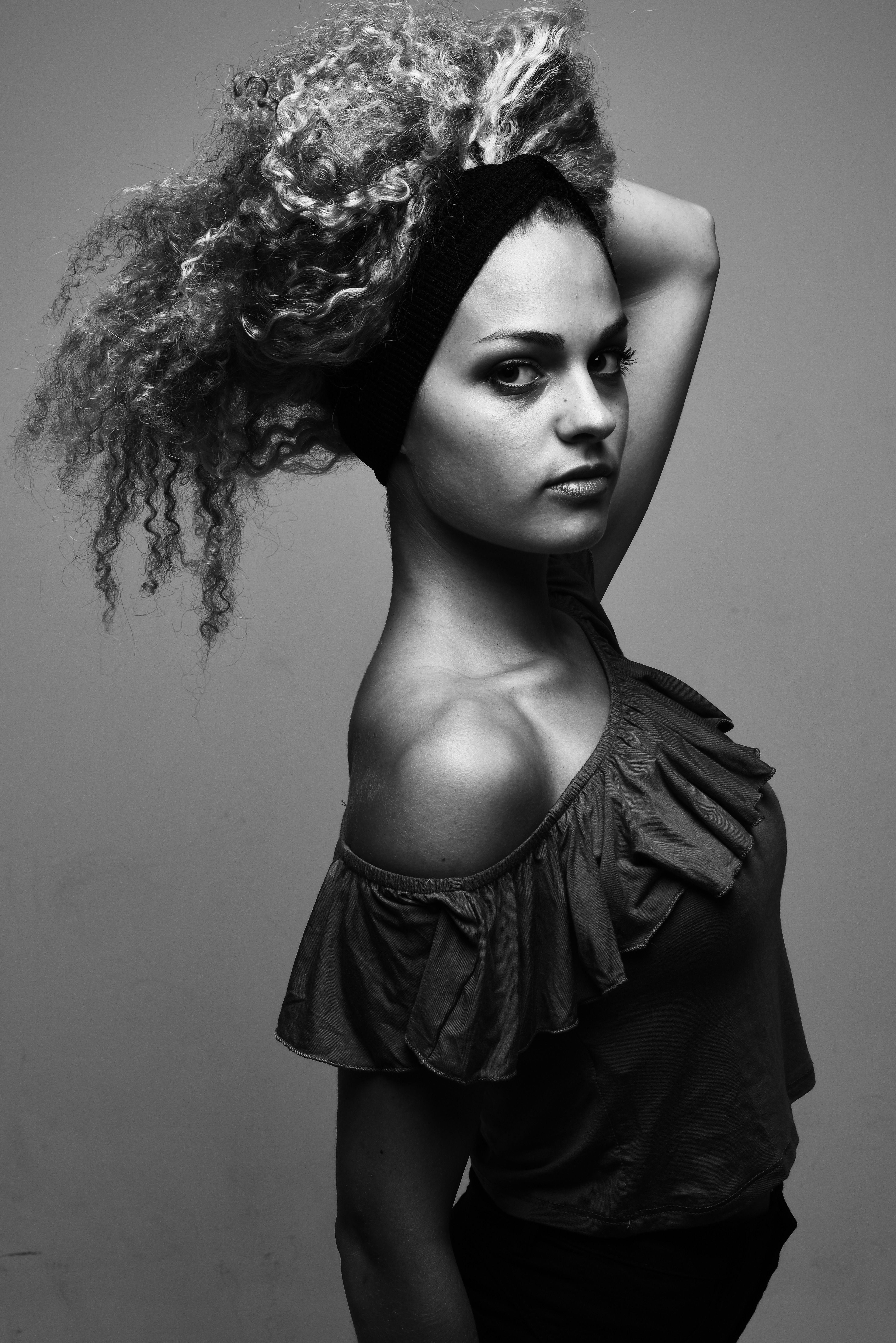 Woman with Curly Hair Posing in Dress in Black and White · Free Stock Photo